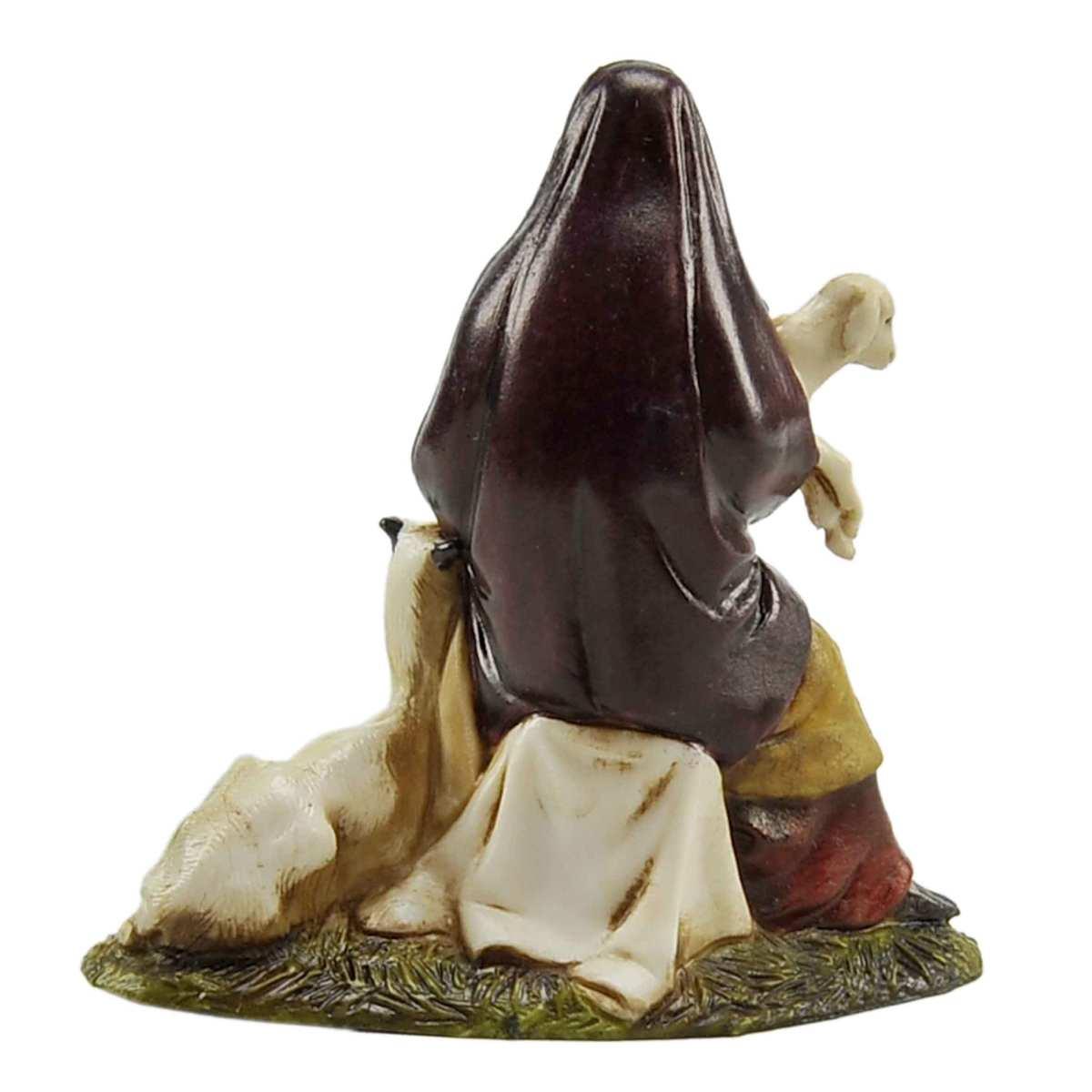 Statua presepe 10 cm donna seduta capre