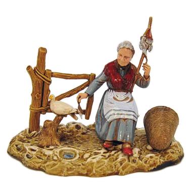 Statua presepe 10 cm donna seduta che fila la colomba