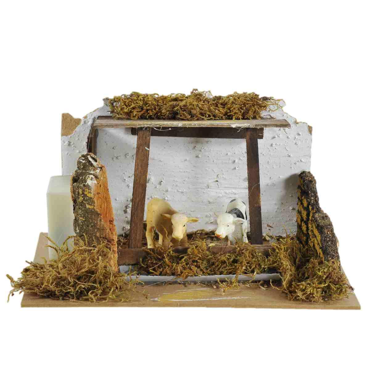 Statua presepe mucche recinto verso