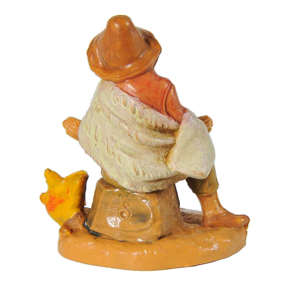 Statua presepe 6.5 cm pastore seduto fuoco