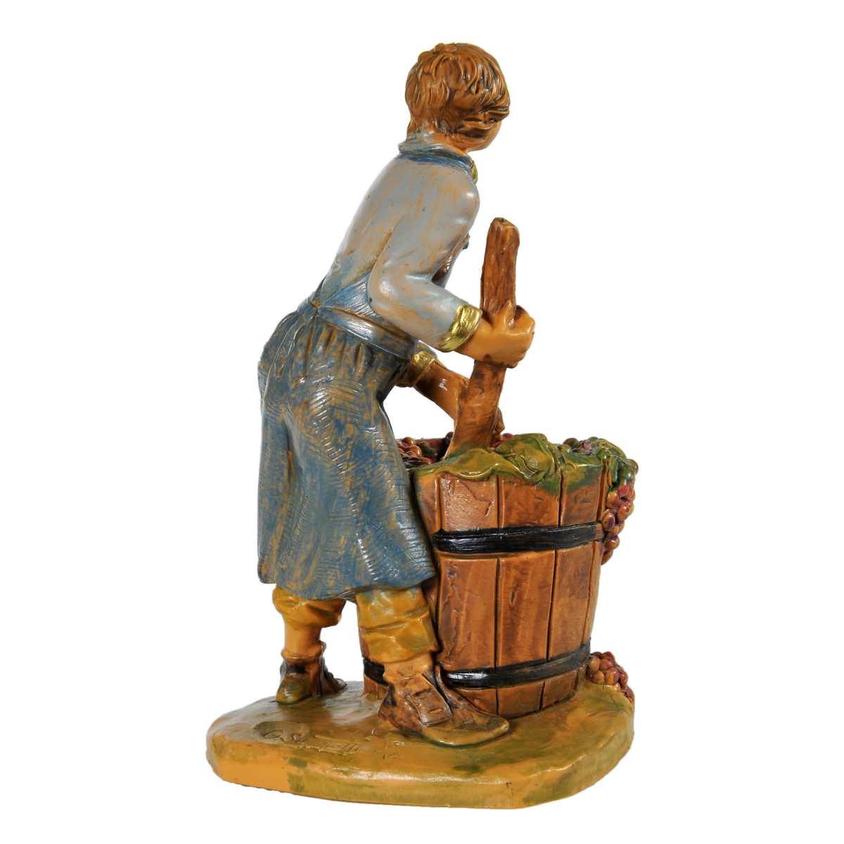Statua presepe 12 cm ragazzo che pigia uva