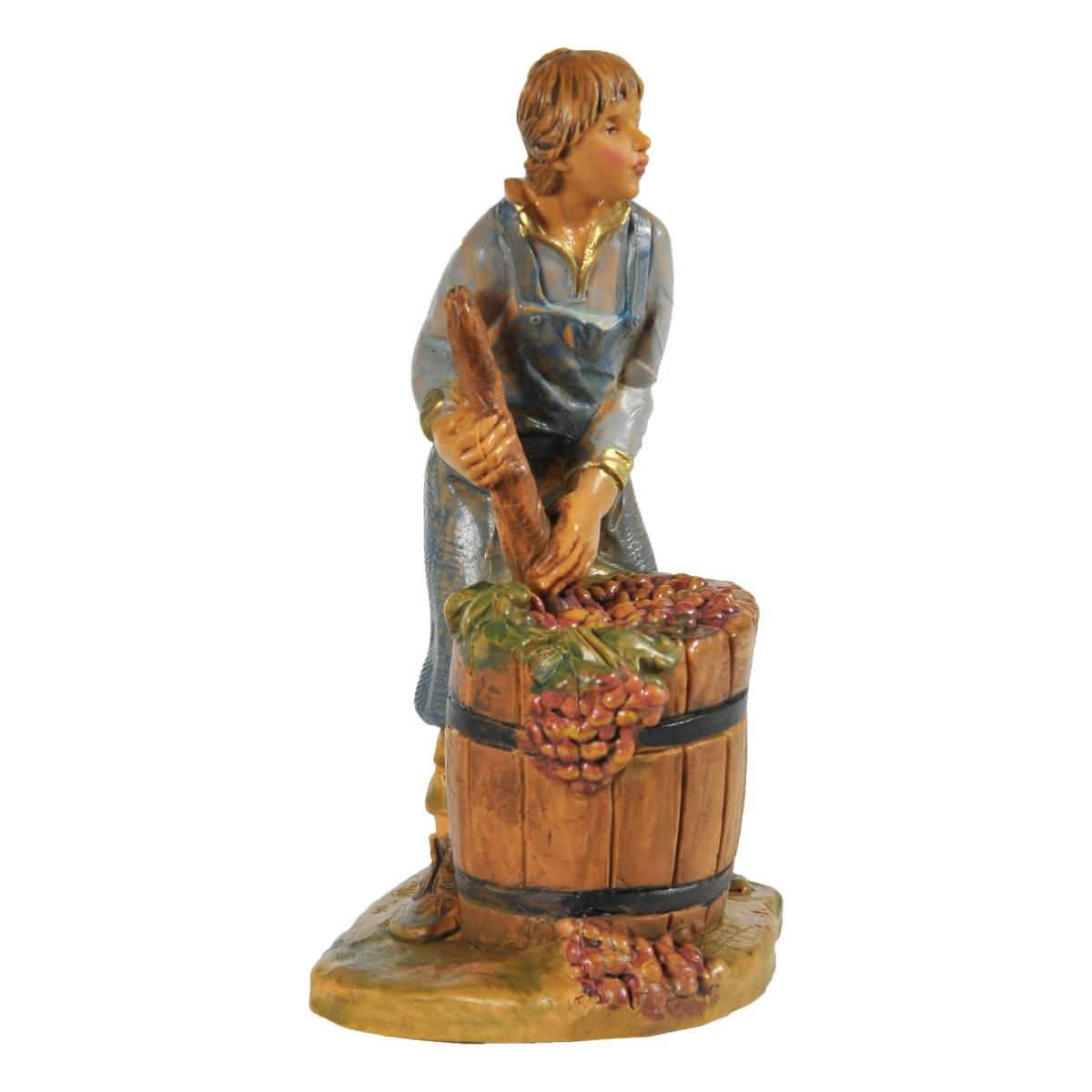 Statua presepe 12 cm ragazzo che pigia uva