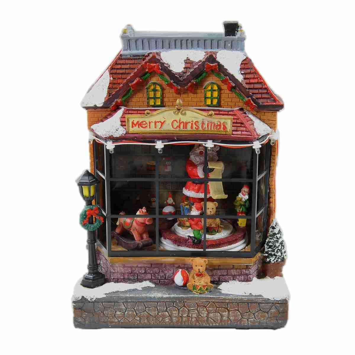 Giostra natalizia bottega babbo luci mov suoni batterie modello a 17 x 15 cm