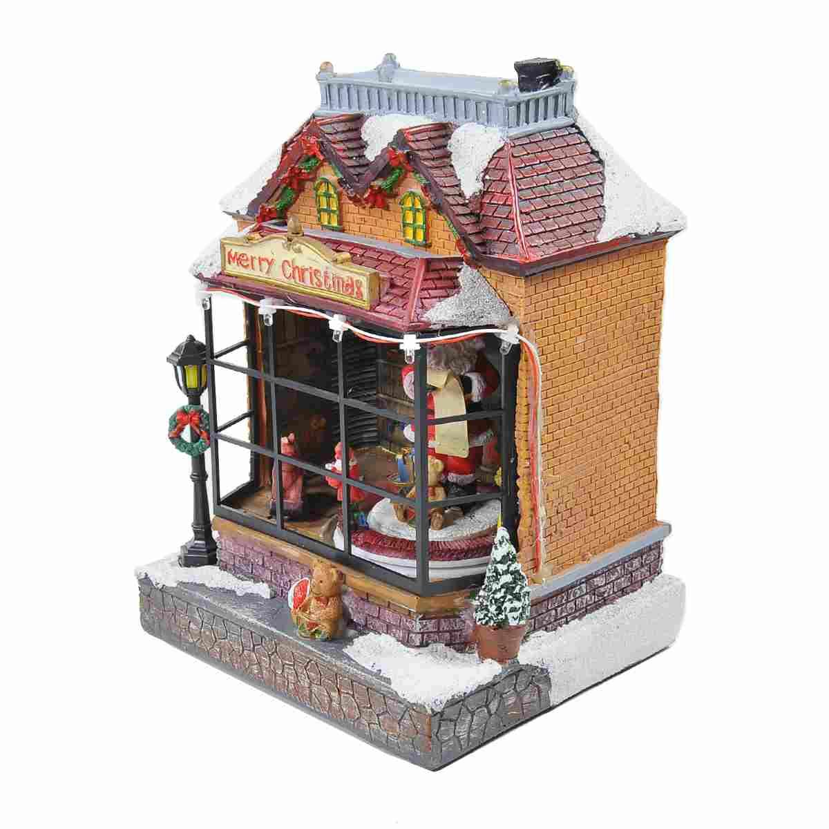 Giostra natalizia bottega babbo luci mov suoni batterie modello a 17 x 15 cm