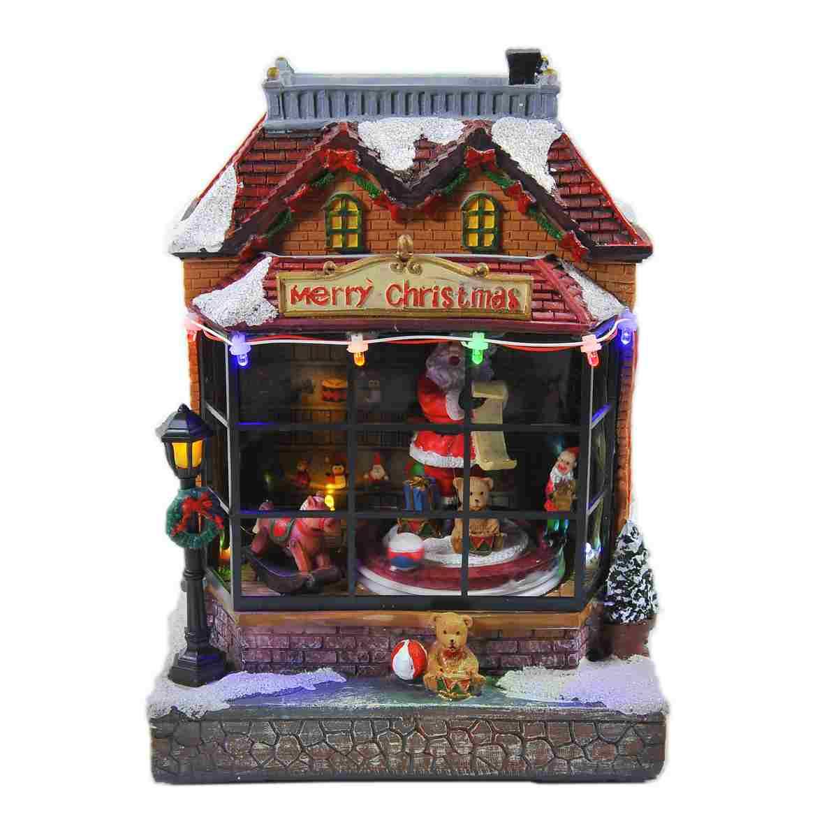 Giostra natalizia bottega babbo luci mov suoni batterie modello a 17 x 15 cm