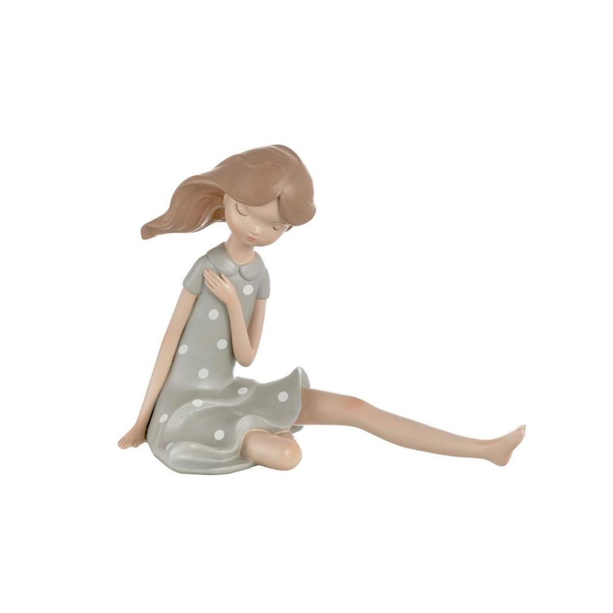 Statua ragazza dream seduta capelli al vento