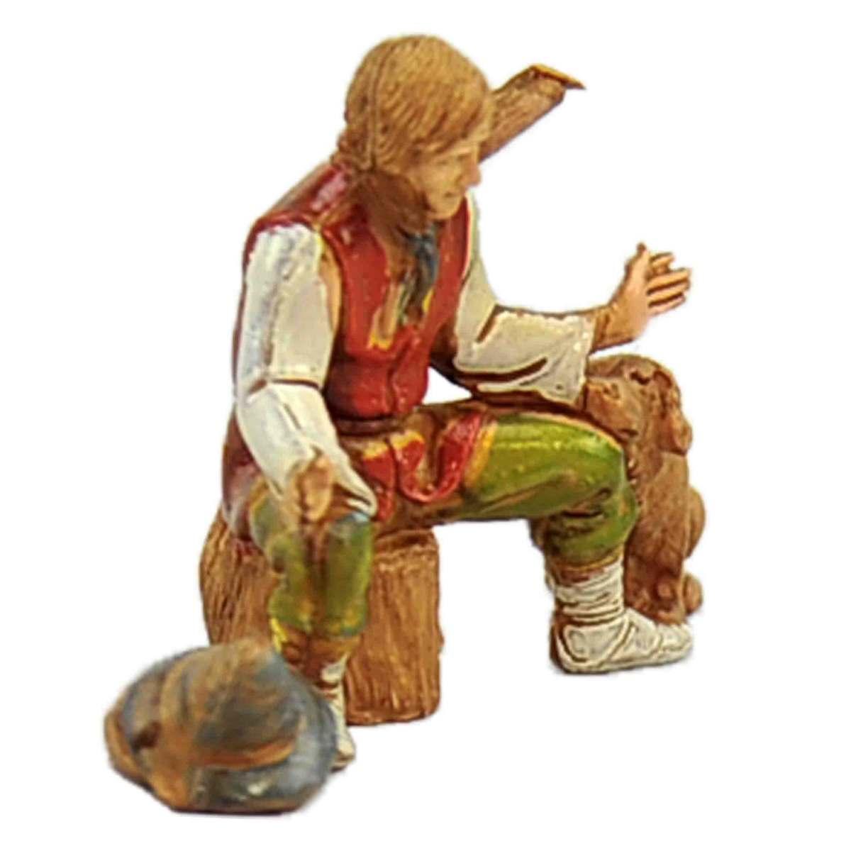 Statua presepe 10 cm pastore seduto sul tronco cane